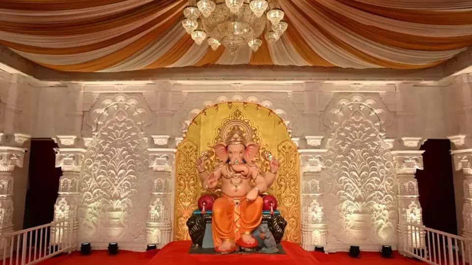 Andhericha Raja Ganpati idol in a white carved pandal in Andheri West, Mumbai