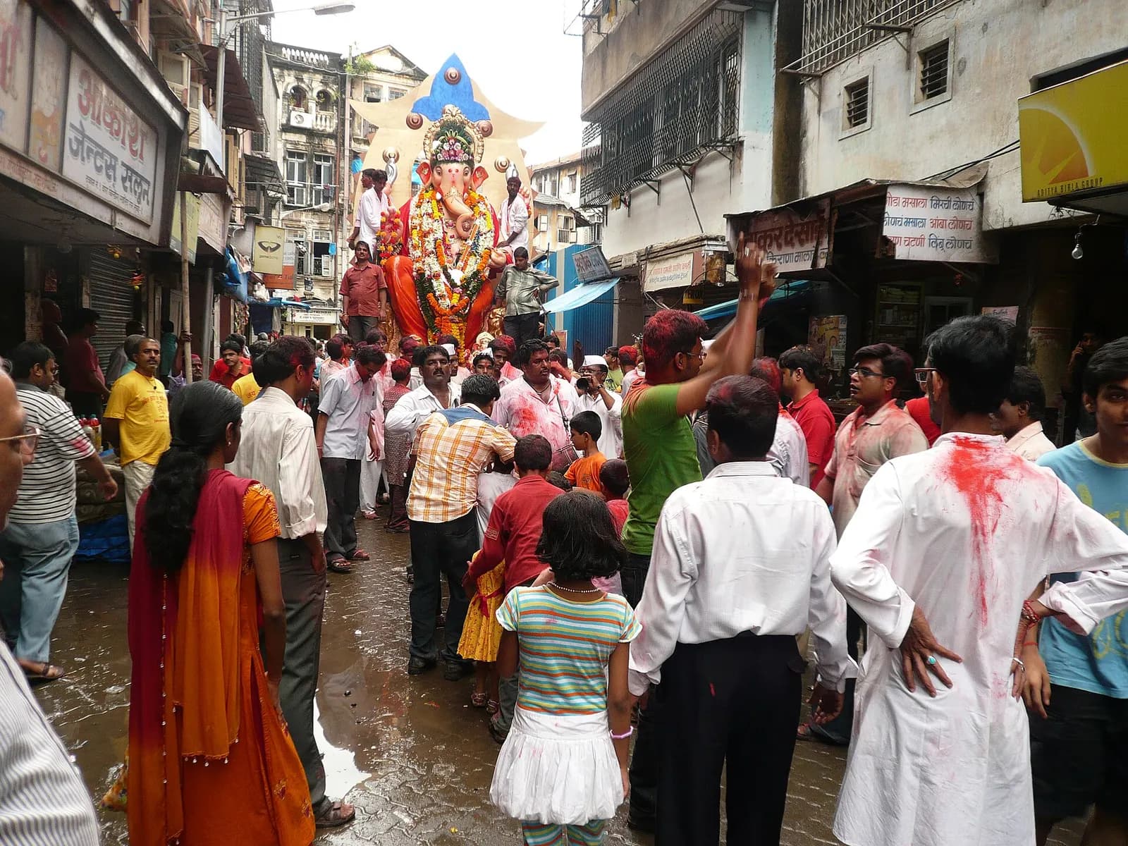 Crowd accompanying a Ganesh idol along a Mumbai street during the Ganesh festival